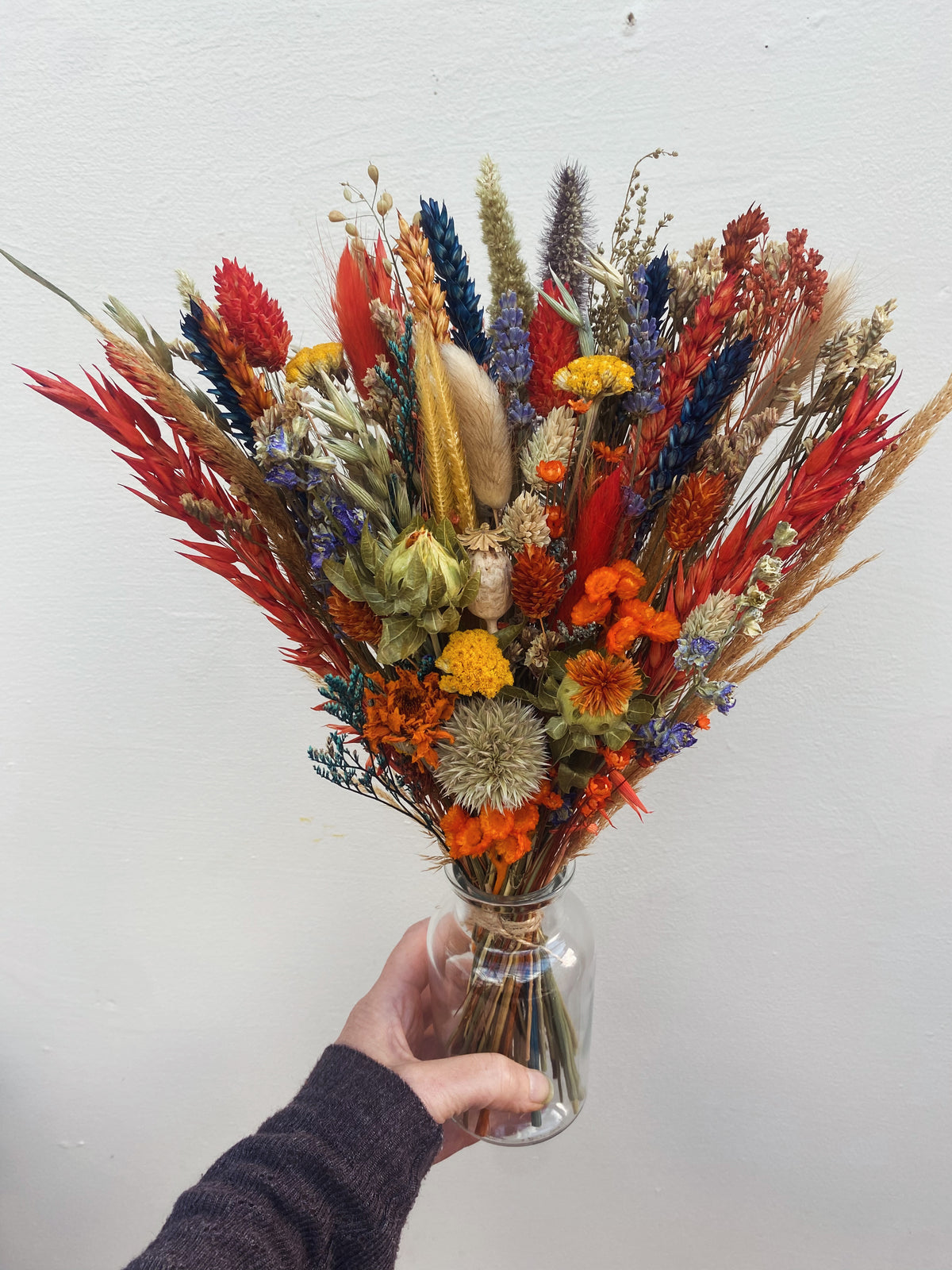 Autumn arrangement in apothecary vase